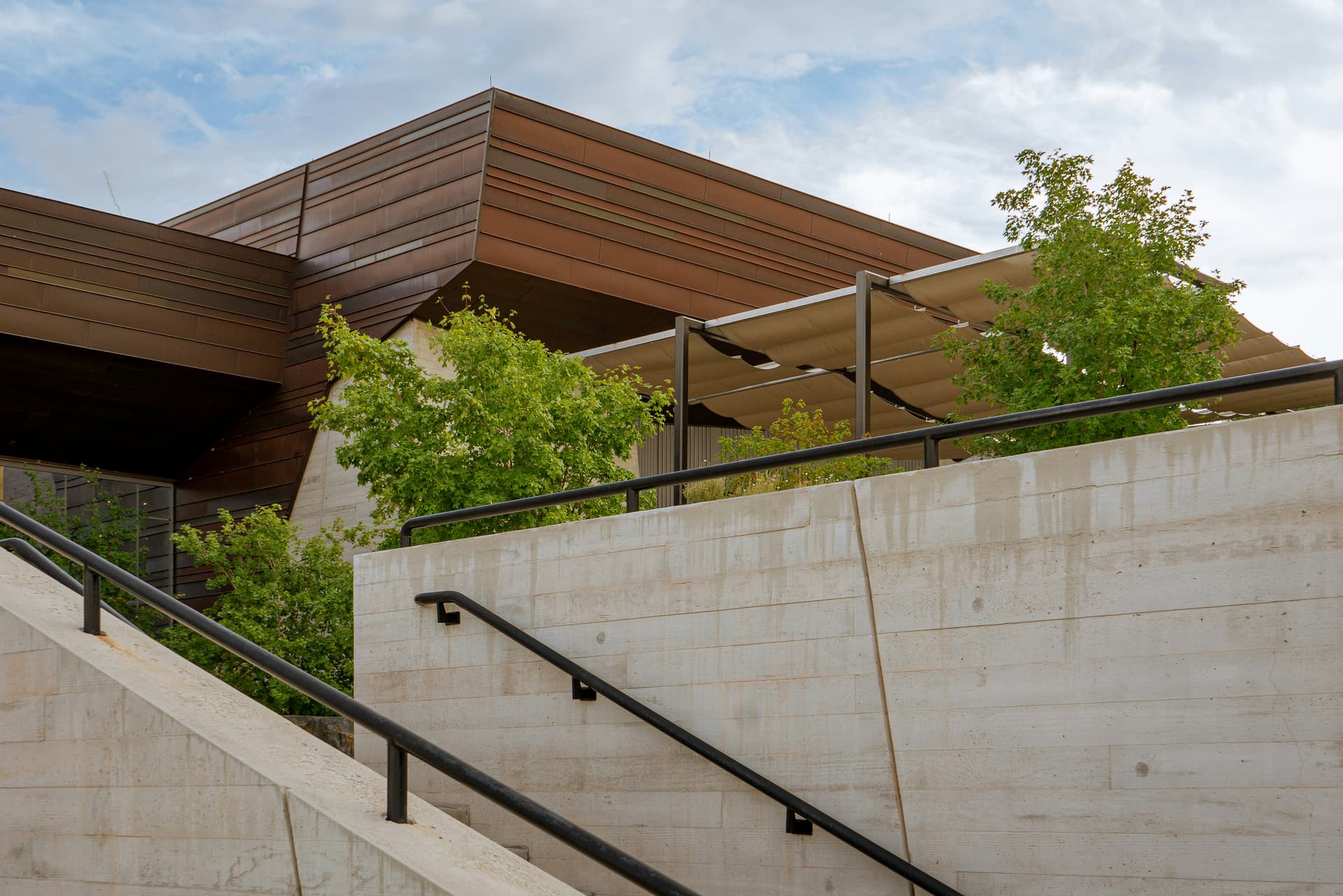 Concrete and timber terraces of a contemporary building in the tropics